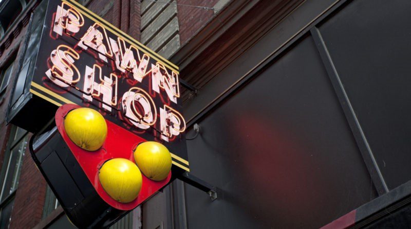Neon pawn shop sign outside Ideal Jewelry and Loan in Brockton, Massachusetts.