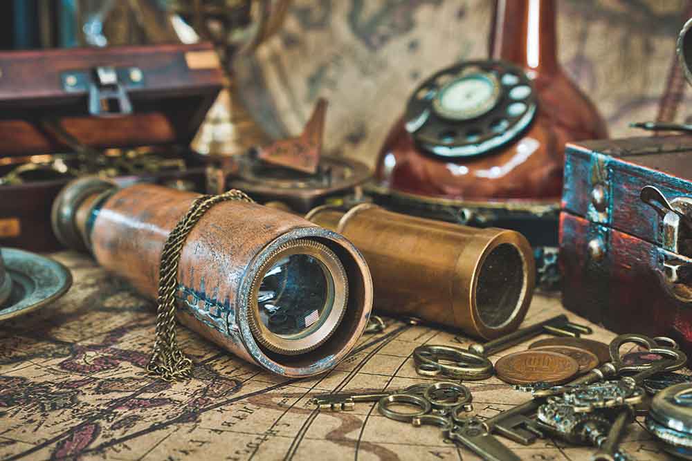 Vintage items like binoculars, keys, and phone at a pawn shop