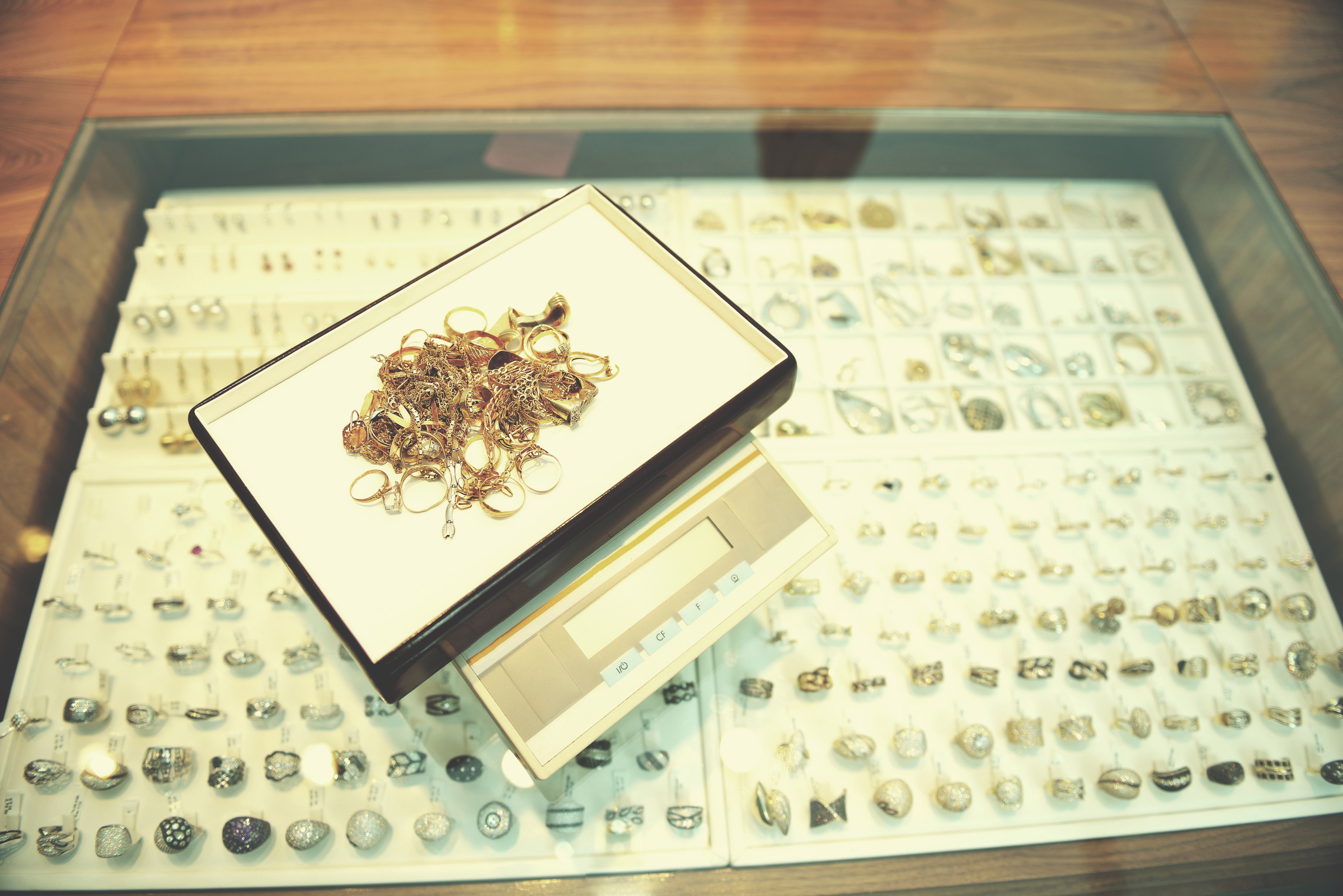 Jewelry Store Counter with Gold Rings and Digital Scale – Ideal Jewelry and Loan