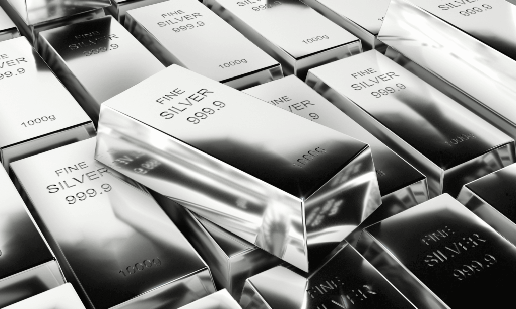 A collection of silver bars with 'FINE SILVER 999.9' and '1000g' labels, with 'FINE SILVER 999.