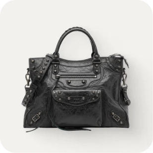 Brockton MA A black leather handbag with a gold buckle and a chain strap
