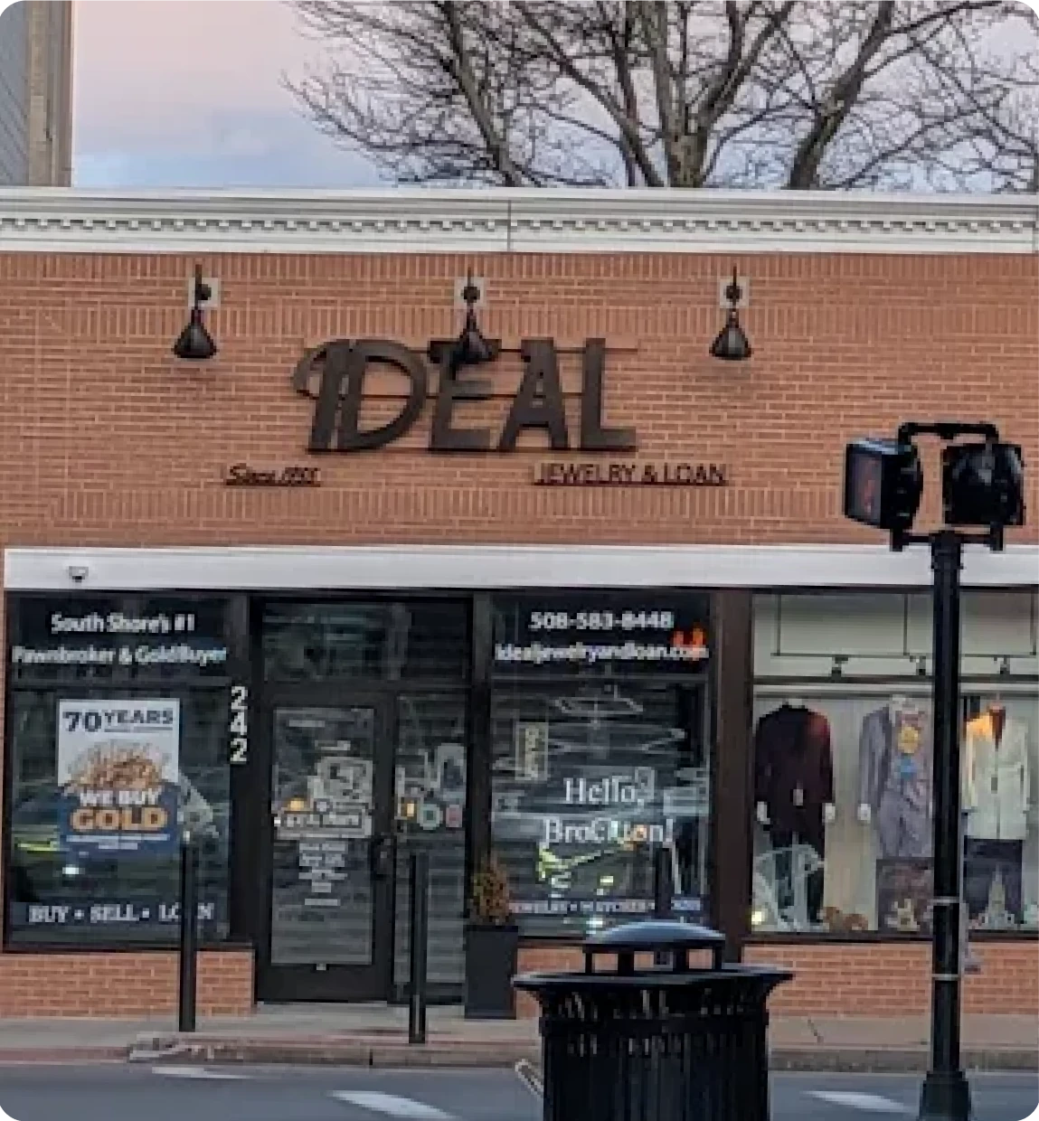 Brockton MA A storefront with a sign reading '1Deal Jewelry & Loan' in a small town