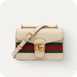 Brockton MA A white handbag with a gold chain and a red and green stripe