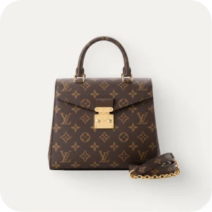 Brockton MA A brown Louis Vuitton handbag with a gold lock and chain strap
