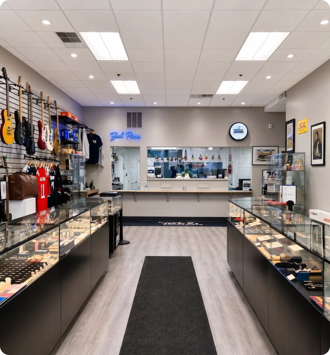 A pawn shop in Brockton MA with a wide selection of items on display, including guitars, jewelry, and other goods