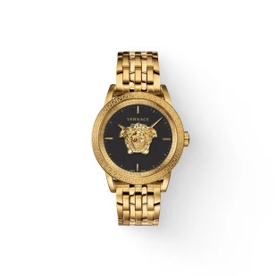 Brockton MA A gold watch with a black face and a gold lion's head on the face