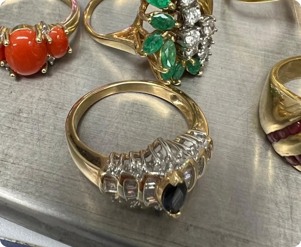 Brockton MA A selection of gold and gemstone rings on a table